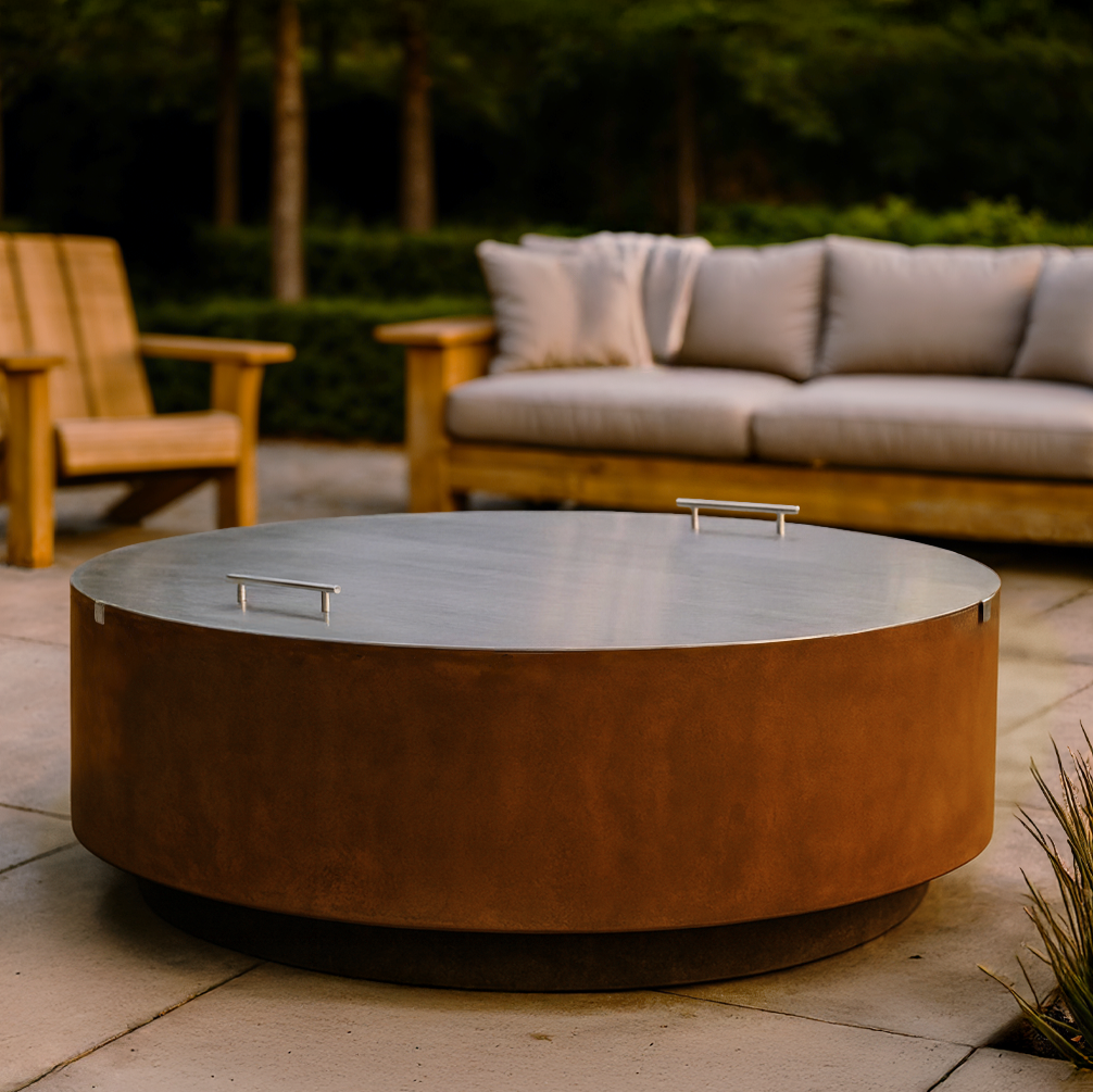 Jake fire pit with lid in an outdoor setting with a couch and chairs.