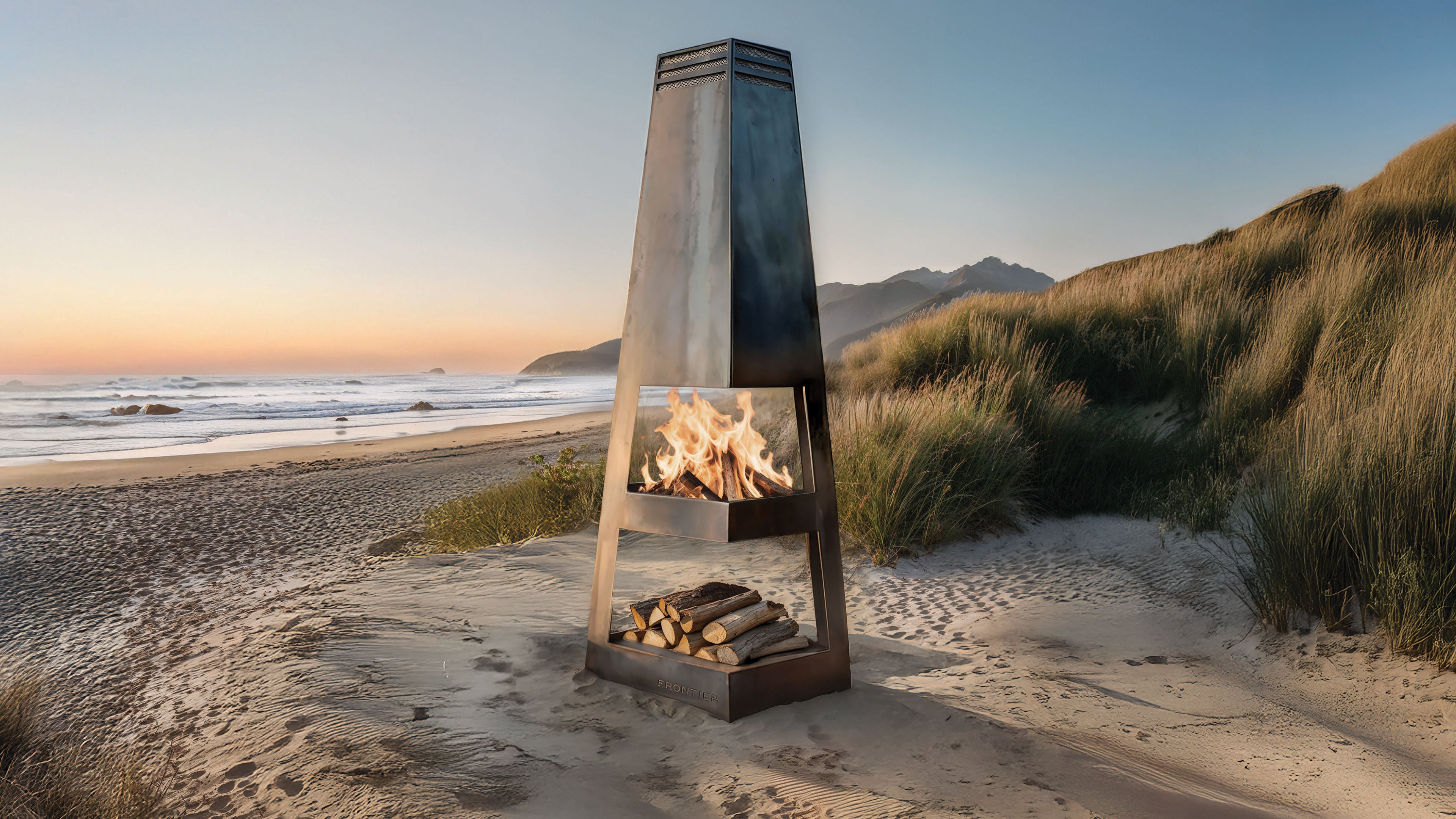 Pierson Chiminea on a sandy beach with ocean and dunes in the background