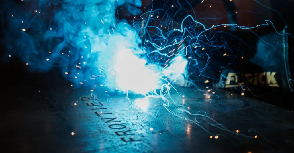 frontier logo being etched into steel