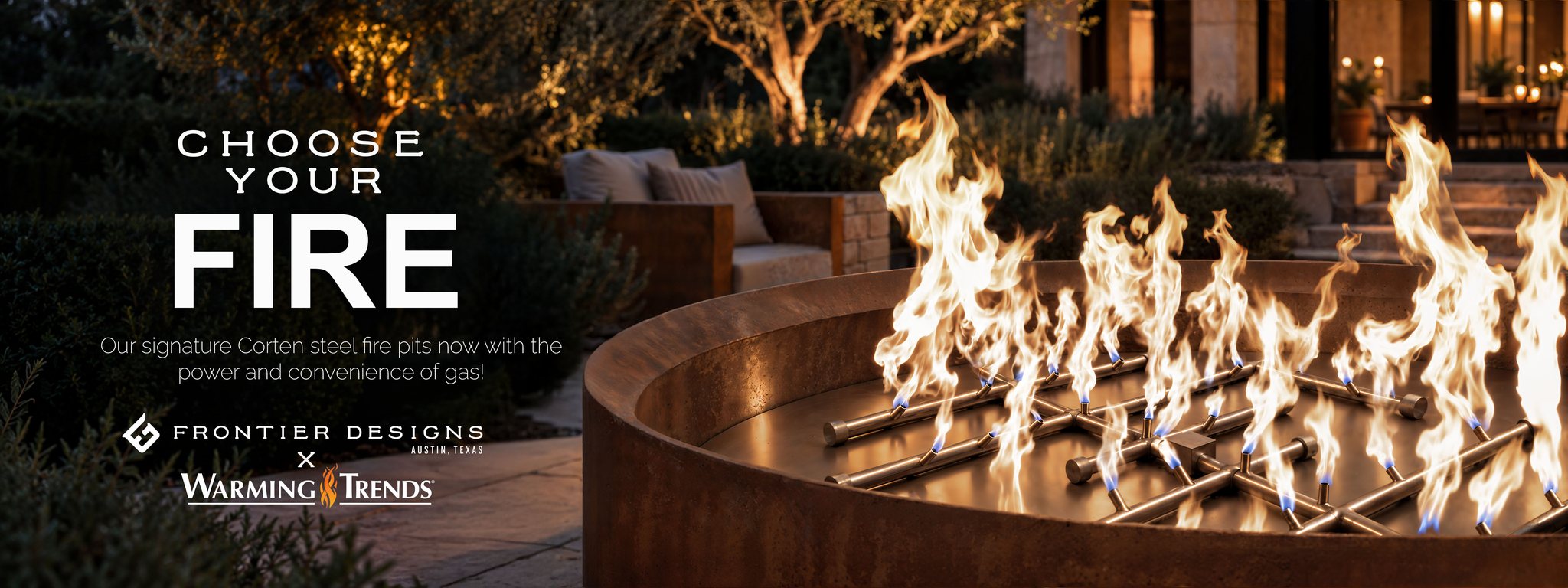 Gas flames on a brass CrossFire burner in a Corten steel fire pit